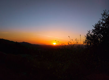 Scenic view of silhouette landscape against sky during sunset