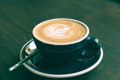 High angle view of cappuccino on table