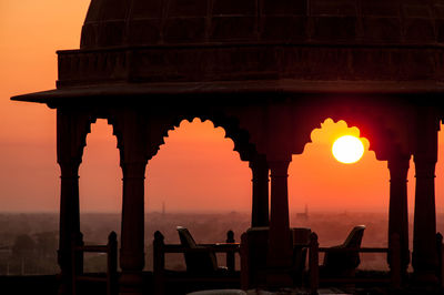 Silhouette of historical building during sunset