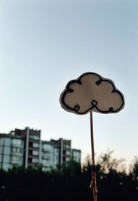 Close-up of street light against sky