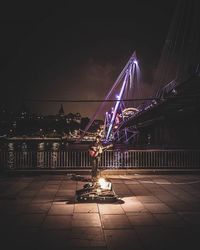 Illuminated suspension bridge at night