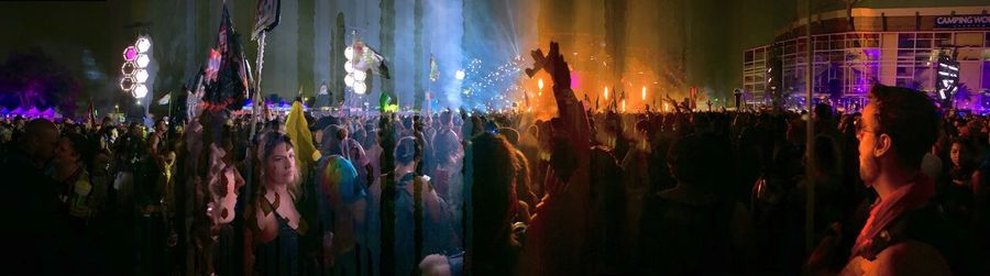 Group of people in illuminated building at night