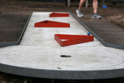 Low section of man playing miniature golf