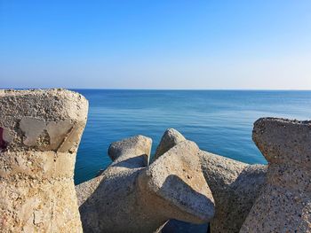 Scenic view of sea against clear blue sky