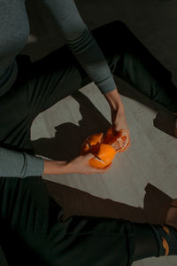 High angle view of baby boy on cutting board