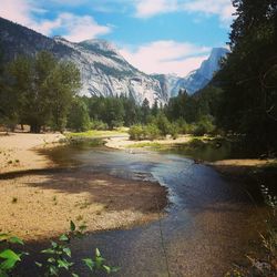 Scenic view of mountains against cloudy sky