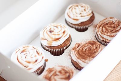 Close-up of banana cupcakes in box on table