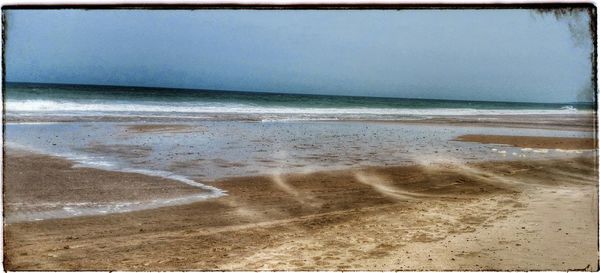 Scenic view of beach against sky