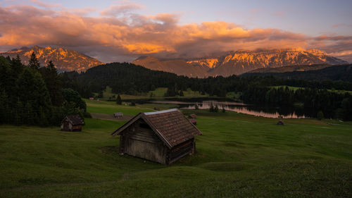 Scenic view of field against sky during sunset