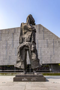 Low angle view of statue against sky