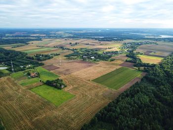 Aerial view of agricultural landscape against sky