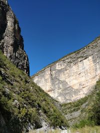 Scenic view of mountain against blue sky