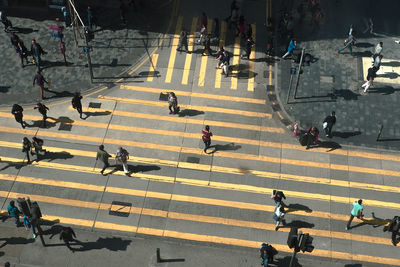 High angle view of people crossing road