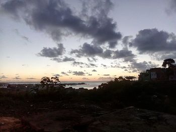 Scenic view of townscape against sky at sunset