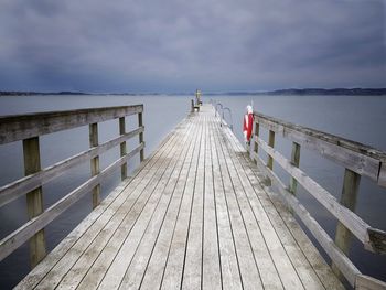 Pier over sea against sky