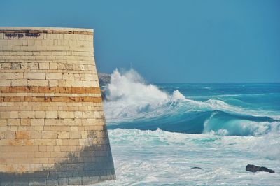 Scenic view of sea against clear blue sky