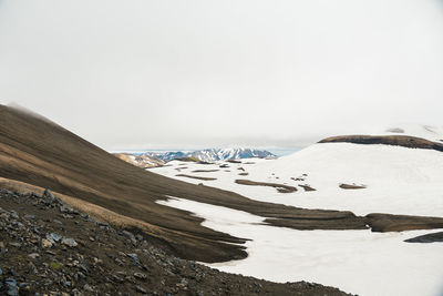 View of snowy landscape in iceland on cloudy day during famous laugavegur trail