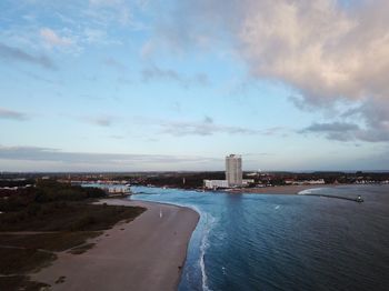 View of sea and buildings against sky