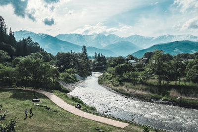 Scenic view of landscape and mountains against sky