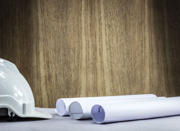 Close-up of white pen on table