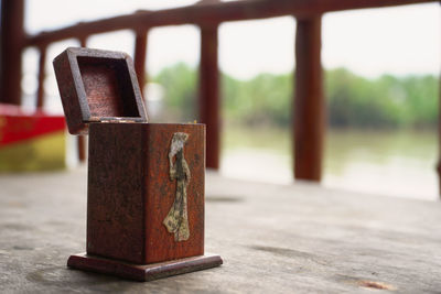 Close-up of old machine on table