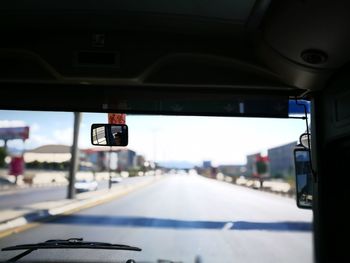 Road seen through car windshield