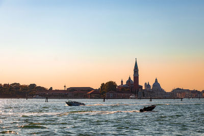 Scenic view of sea against clear sky during sunset