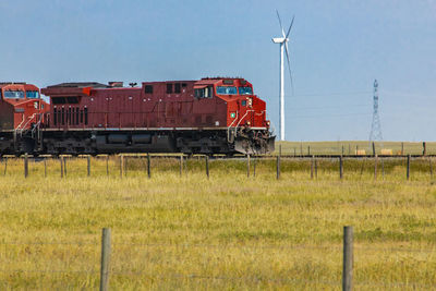 Train on railroad track against sky