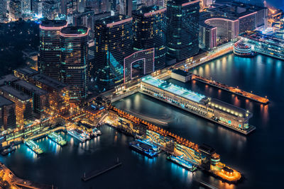 High angle view of illuminated harbor in city at night