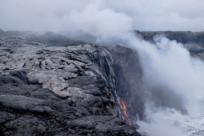 Smoke emitting from volcanic mountain