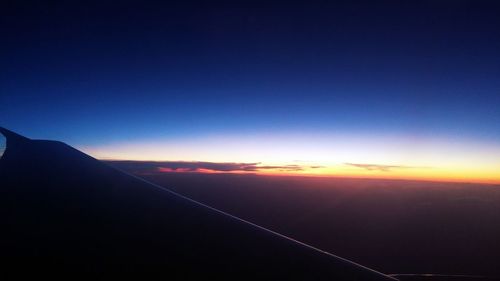 Scenic view of landscape against sky at sunset