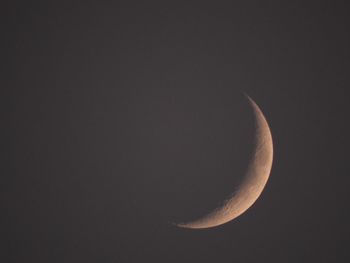 Low angle view of moon against clear sky at night