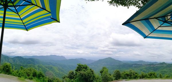 Low angle view of parasol against sky