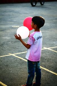 Boy playing with balloons