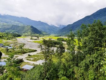 Scenic view of landscape and mountains against sky