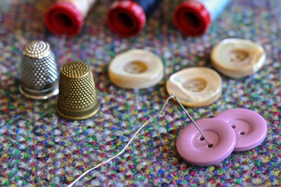 High angle view of various buttons on table