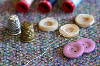 High angle view of various buttons on table