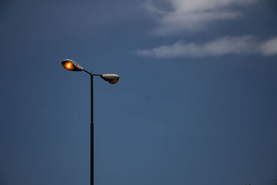 Low angle view of street light against sky