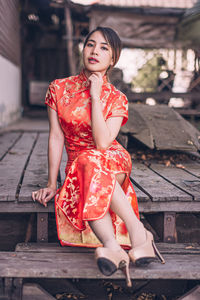 Portrait of woman sitting on bench