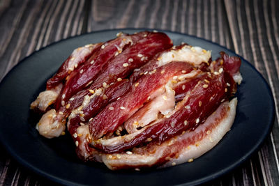 High angle view of meat in plate on table