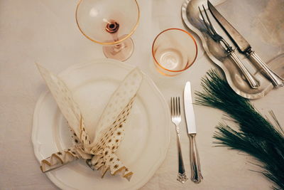 High angle view of plate with glasses on table