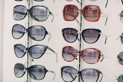 Close-up of sunglasses with reflection on street