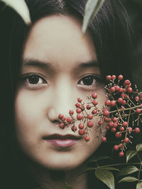 Chinese girl among red berries iii