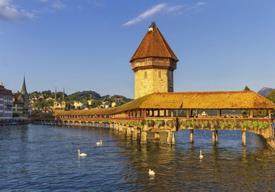 Kapellbrucke chapel covered bridge and water tower in luzern by day, switzerland