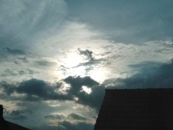 Low angle view of silhouette building against sky at sunset