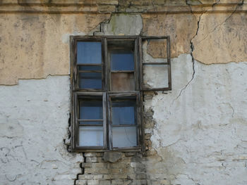 Low angle view of window on old building