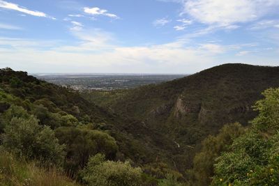 Scenic view of landscape and sea against sky