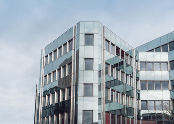 Low angle view of modern buildings against sky