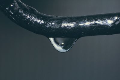 Close-up of water drops on metal