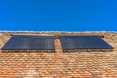Low angle view of roof against clear sky